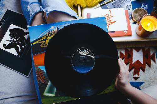 united states person holding Epic vinyl record black
